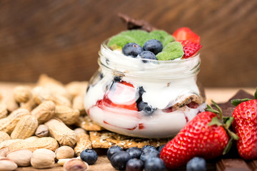Dessert with strawberries on a wooden table