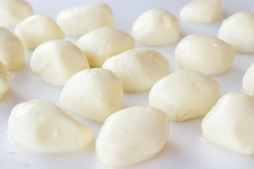 Fototapeta na wymiar Mozzarella balls on a white background