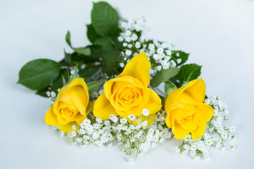 Bouquet of yellow roses with gypsophila