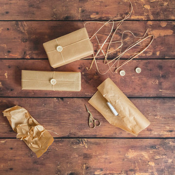 Brown paper packages wrapped up in string