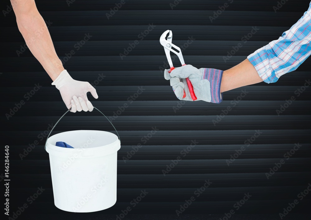 Poster hand with cube and hand with other tool in front of blind
