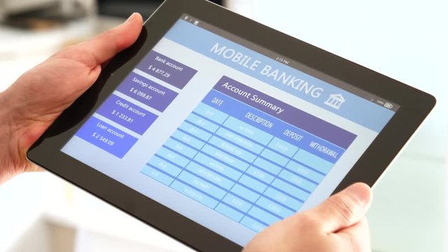 Mobile banking on a tablet screen.