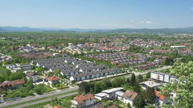 The views of the European modern village near an old town in a natural forested area, aerial, 4K - 2