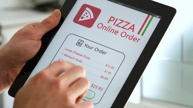 Ordering pizza from a tablet app.