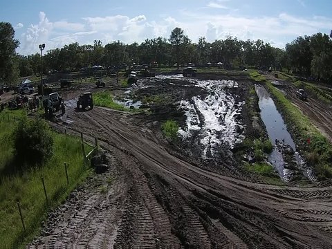 Various trucks Are riding around and racing on tracks and mud pit - 1