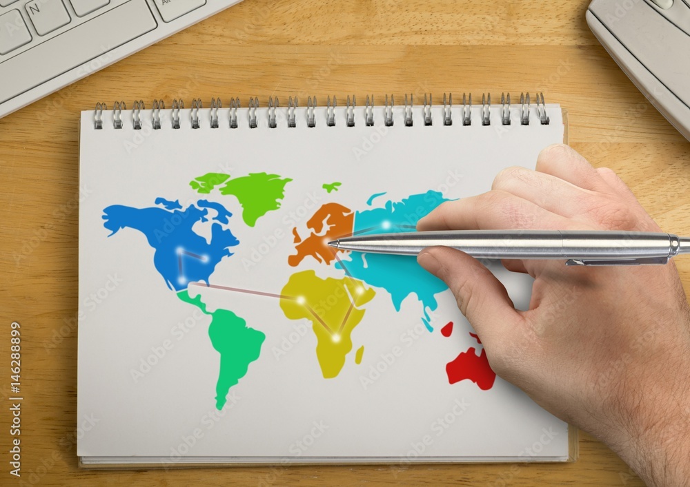 Poster hand writing with pen on colorful map on a notepad