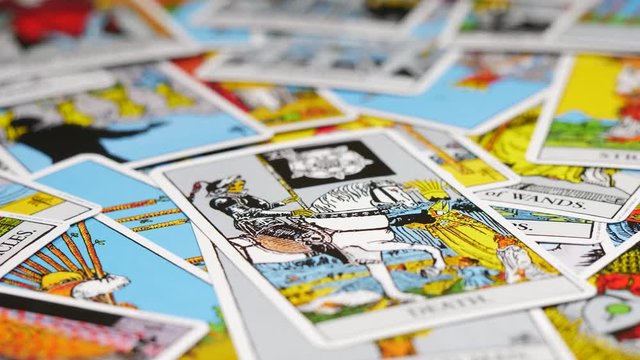 Focus rack / focus pull of tarot card on a table.