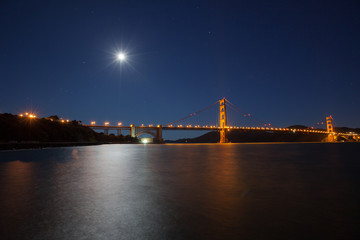 Full moon overhanging the Golden Gate Bridge