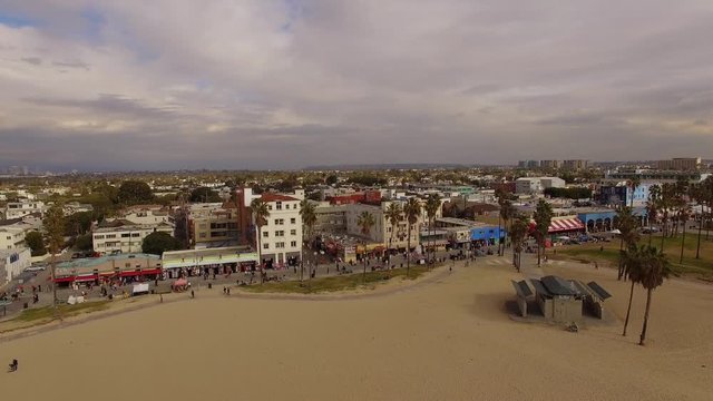 The Venice Beach in Los Angeles, the buildings of hotels, people walking on the beach, Aerial - 1
