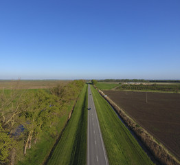 Road route. A view from above on a two-lane road in a rural area. Asphalt road.