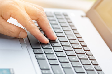 hands businessman working with laptop devices and using digital computer for searching online,business concept,selective focus