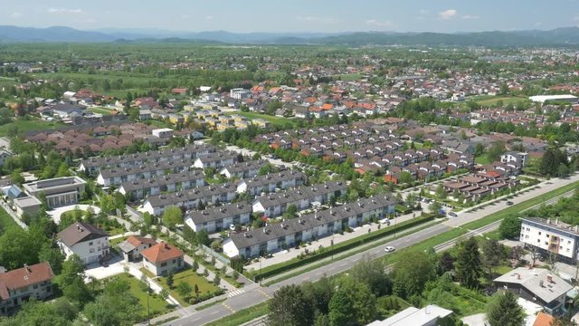 The views of the European modern village near an old town in a natural forested area, aerial, 4K - 5