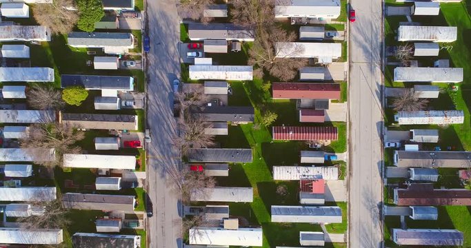 Aerial view looking down on vast trailer park, mobile homes.
