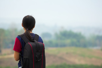 The girl walked shoulder bag