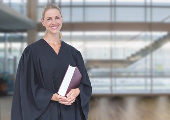 Judge holding book in front of windows