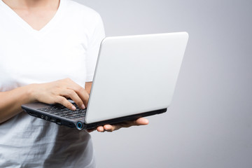 Naklejka premium Woman holding laptop