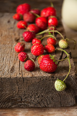 Close up of fresh strawberries on a wooden board.