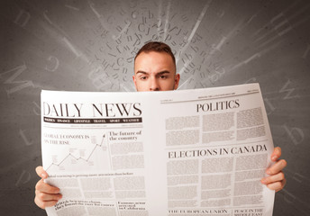 Businessman reading newspaper
