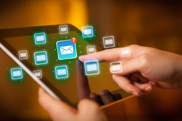 Fingers touching tablet with mail