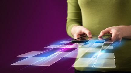 Fototapeta premium Close up of hand holding tablet with cyber application