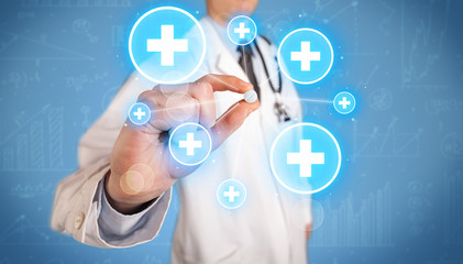 A doctor showing a pill with crosses