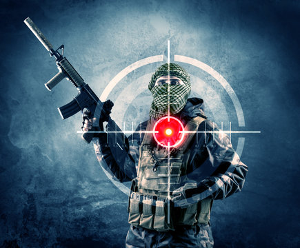 Masked terrorist man with gun and laser target on his body