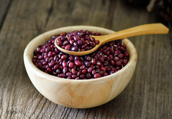 azuki  beans in wood bowl on table