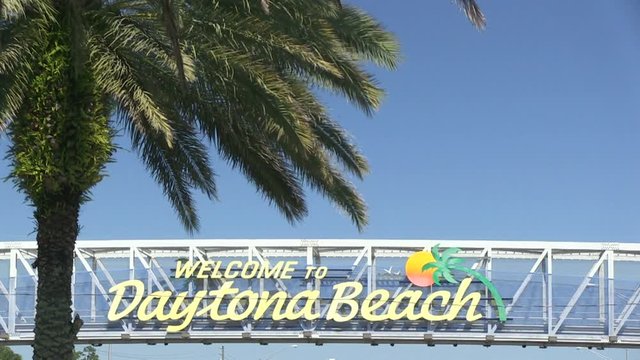 Welcome to Daytona Beach sign located above the roadway, Florida, USA - 4