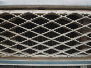 retro background or texture old car front mask