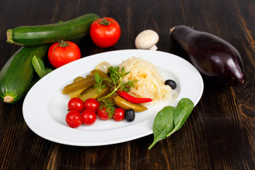 Appetizer of tomatoes, cucumbers, cabbage and pepper