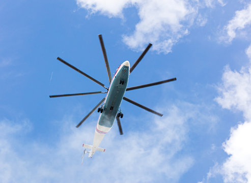 heavy cargo helicopter flying against blue sky