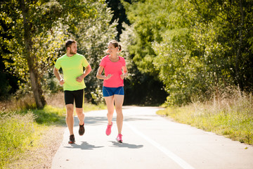 Fototapeta premium Couple running and talking together