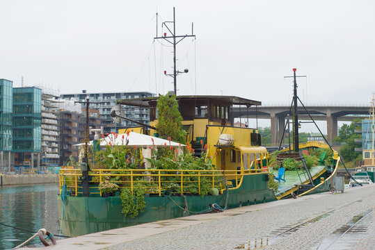 Old ferry turned into a floating flower garden near the Norra Hammarbyhamnen , Stockholm, Sweden