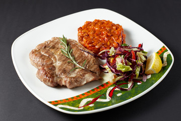 Pork steak with beans. Mexican food. Mexican cuisine.