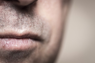 The lower part of the adult human face close-up.