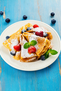 Crepes with berries, blueberry and strawberry