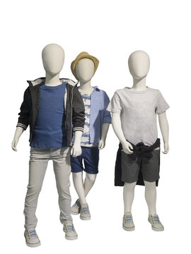 Three mannequins dressed in casual kids wear.