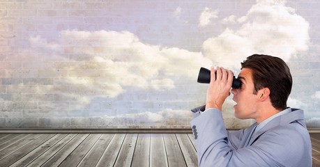 Man looking through binoculars