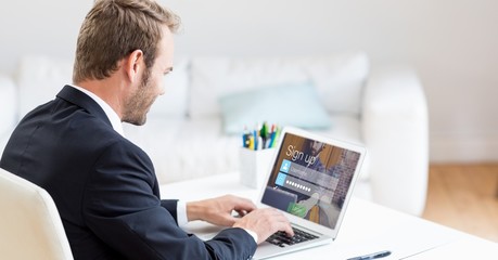 Businessman signing up on web page using laptop