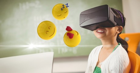Happy girl looking at emojis on VR glasses