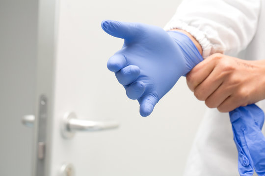 Researcher Wearing Protective Laboratory Gloves