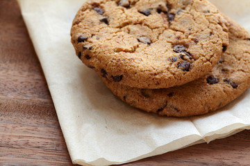 Chocolate chips cookies on the wooden table. quick and eays meal in the morning. Close up shot.