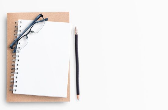 Blank Notebook With Pencil And Eyeglasses On White Background