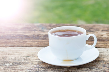 cup of tea with lemon on wooden background