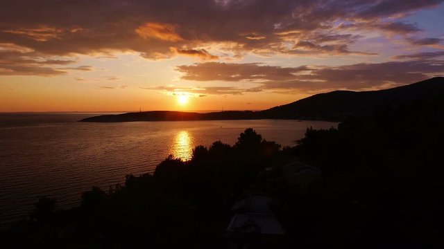 The beautiful scenic sunset on the sea and the beach, the town at the sunset - 1