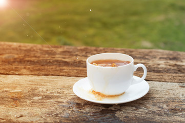 cup of tea with lemon on wooden background