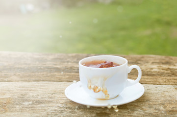 cup of tea with lemon on wooden background