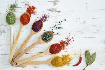 Spices and herbs on wooden background