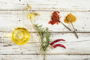 Spices and herbs on wooden background