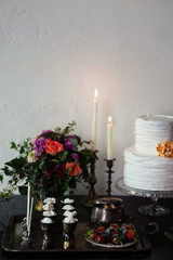 Wedding sweet table inspired by Dutch masters still lifes. Dark shadows, window light, grain, shallow depth of field.